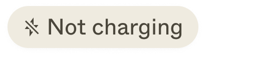 A light gray charging status pill with an icon (crossed over lightning symbol) and a label ("not charging")